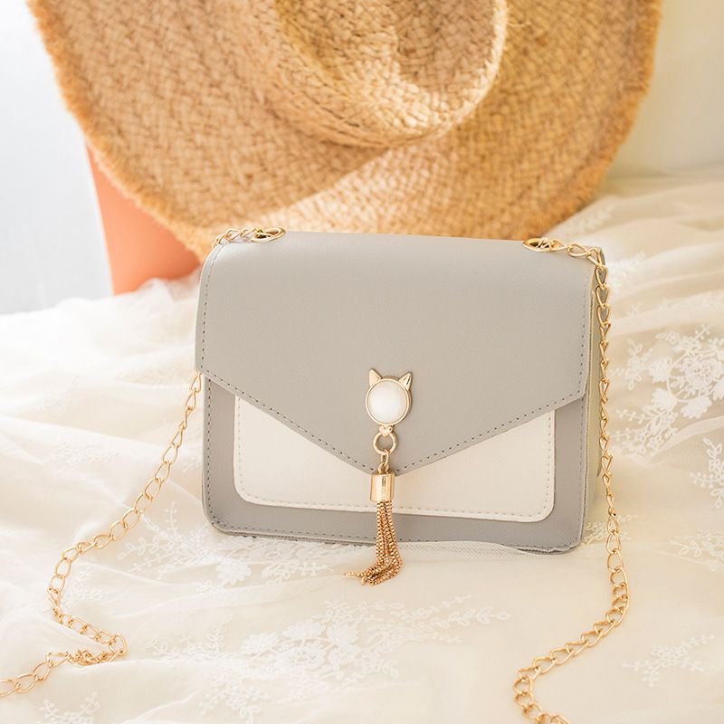 Women Chic Flap Buckle Design Cat Tassel Decoration Color Blocking PU Crossbody Bag